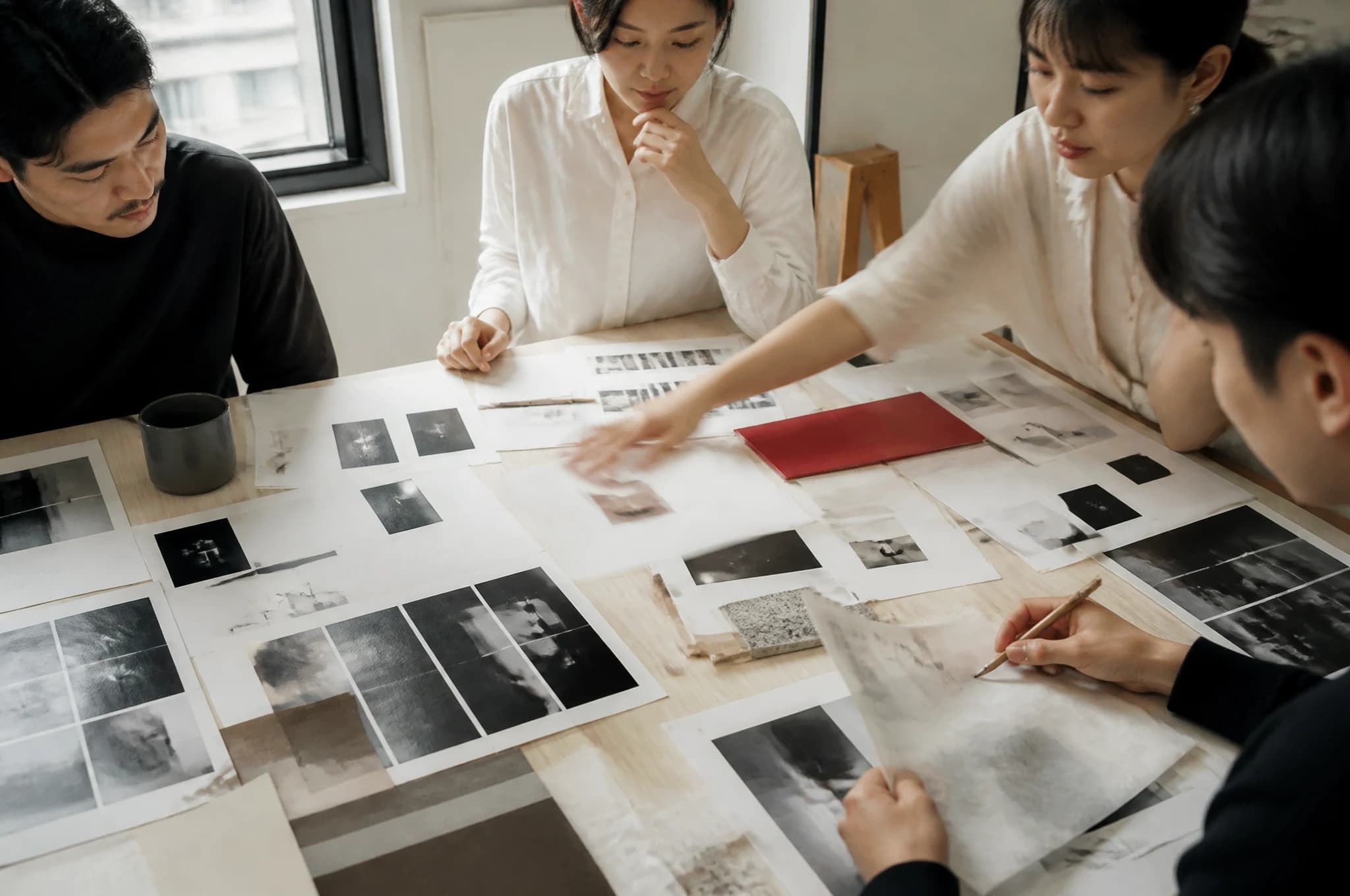 A brand team works through positioning around a bright studio table
